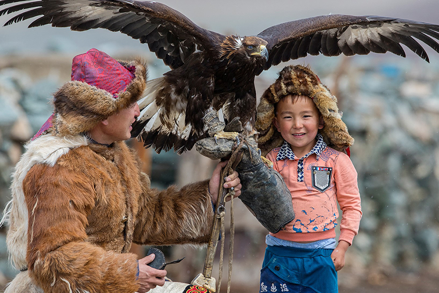 Asilbek-and-his-son-eagle-hunting-next-generation-mongolia adventure tours